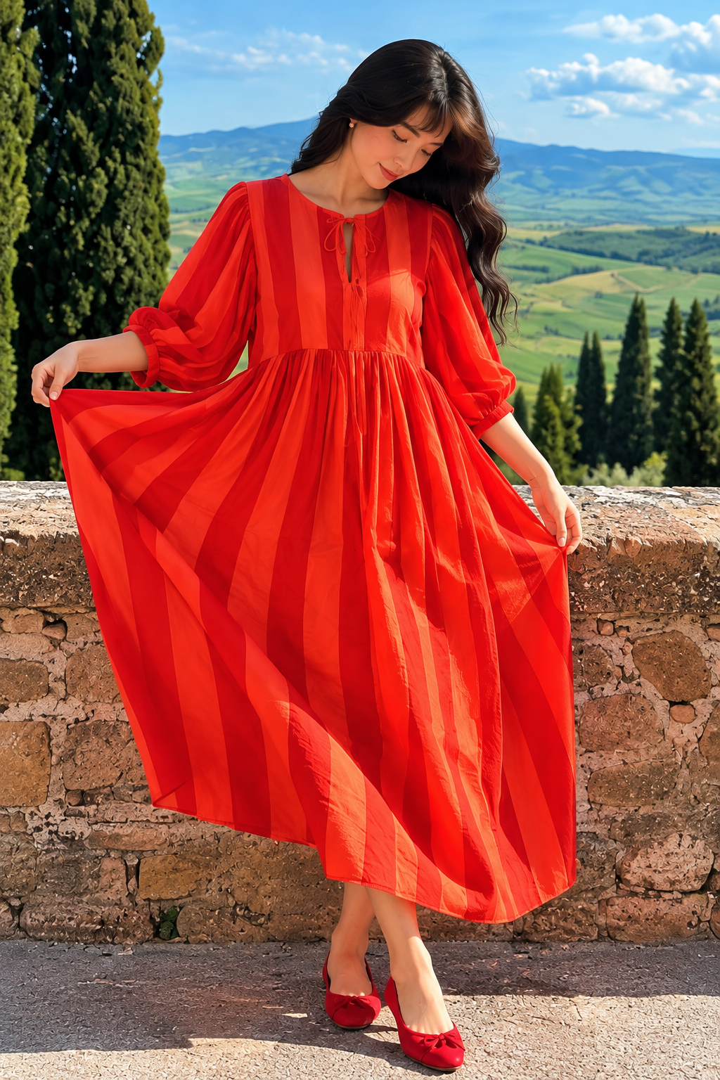 Red long dress featuring a round neckline and front tie detail