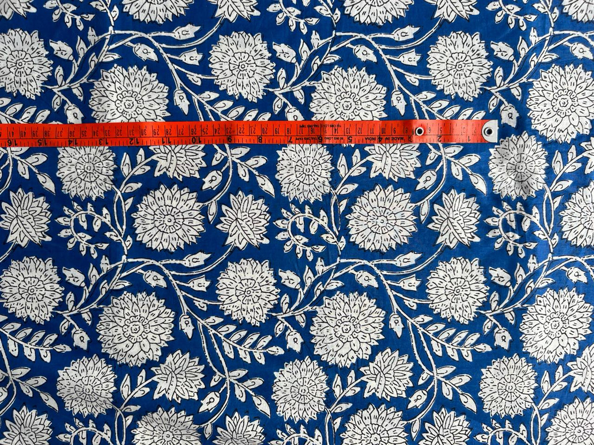 Blue botanical cotton fabric with leafy vines