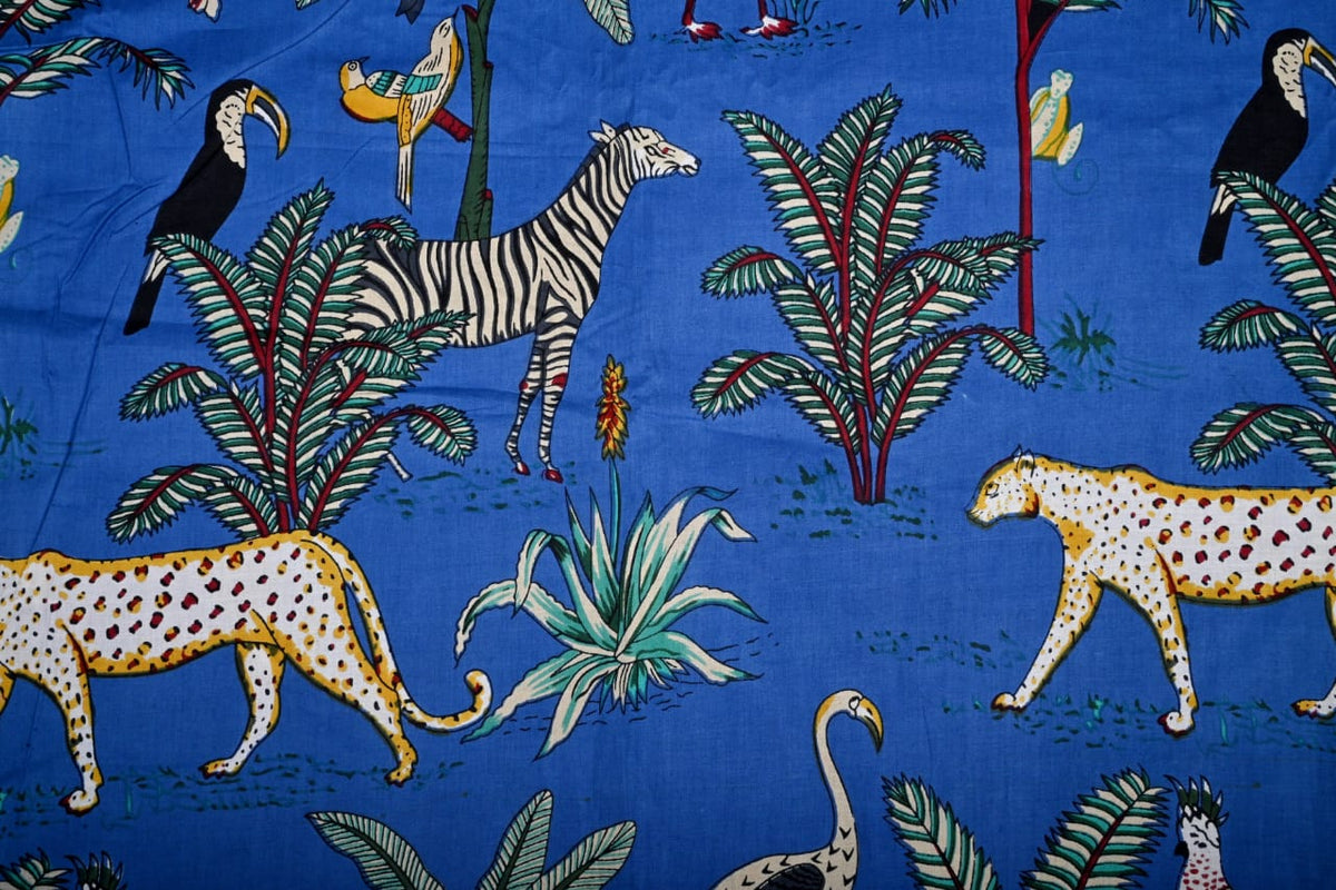 Tropical jungle fabric with animals and palm trees