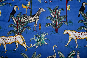 Tropical jungle fabric with animals and palm trees