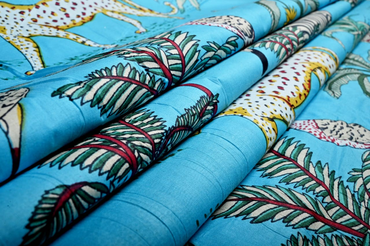 Safari fabric with exotic birds and tropical foliage
