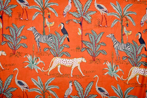 Tropical jungle fabric with animals and palm trees