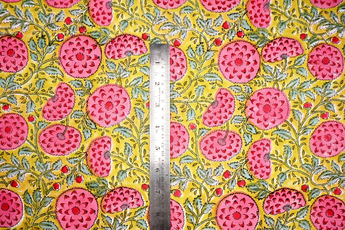 Yellow botanical block print textile with leafy vines