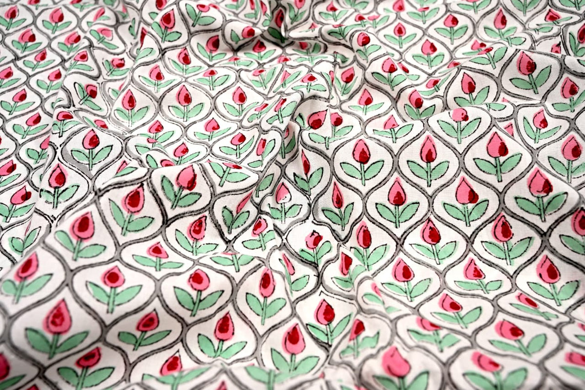 Cream fabric with pink and red rose bud motifs