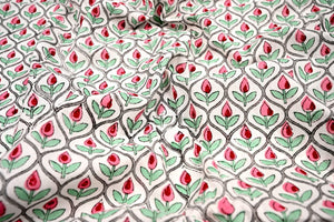 Cream fabric with pink and red rose bud motifs