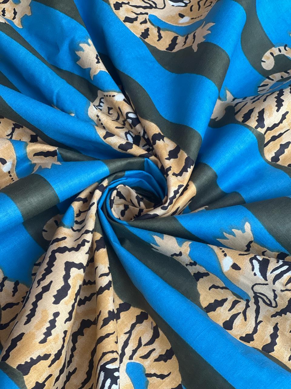 Golden tiger print fabric with blue stripes
