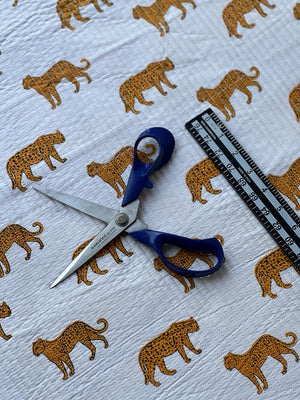 Detailed view of leopard print quilting for sewing and craft projects.