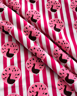 Pink bird print quilting cotton fabric with a bold striped background.